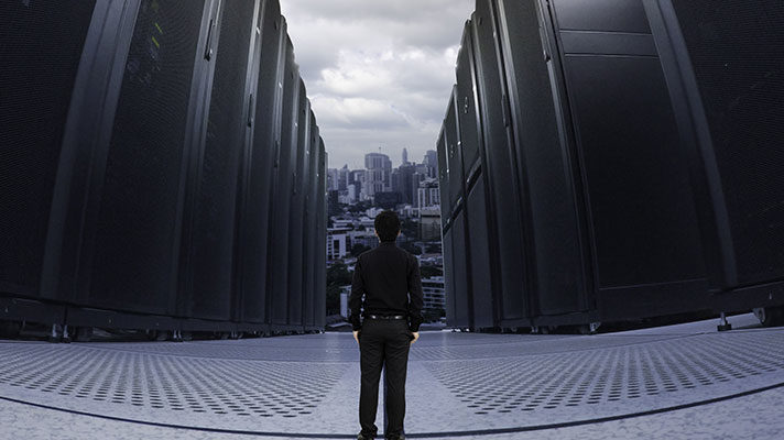 man standing in front of server aisle