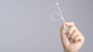 hand holding zip tie