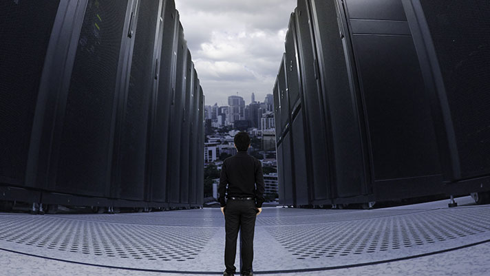 man standing in front of server aisle